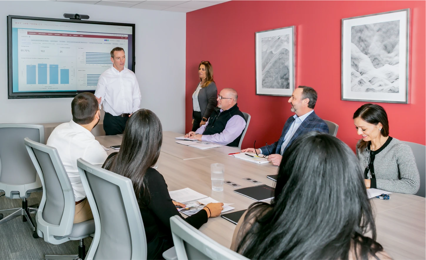 Business professional leading a corporate meeting in a modern conference room