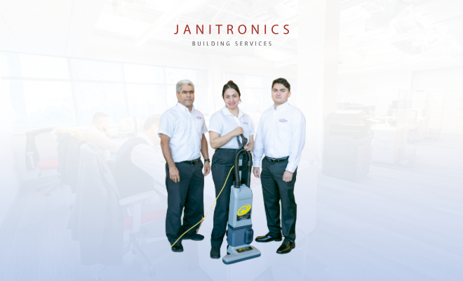three commercial office building janitorial services workers together