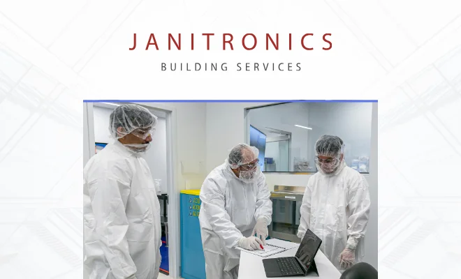 Janitronics cleaners working in a cleanroom to help pass cGMP inspection from the FDA