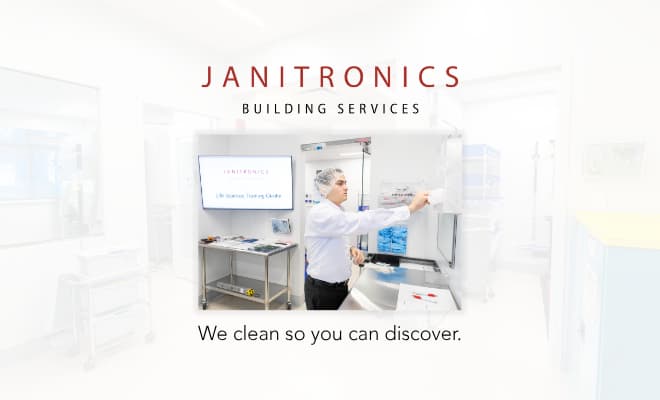 A janitorial services worker cleaning a cleanroom